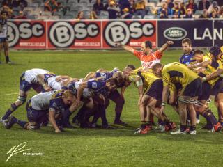 It's time for a scrum as the ACT Brumbies host the visiting Hurricanes from New Zealand.  Nice telephoto shot before the scrum packs down.
