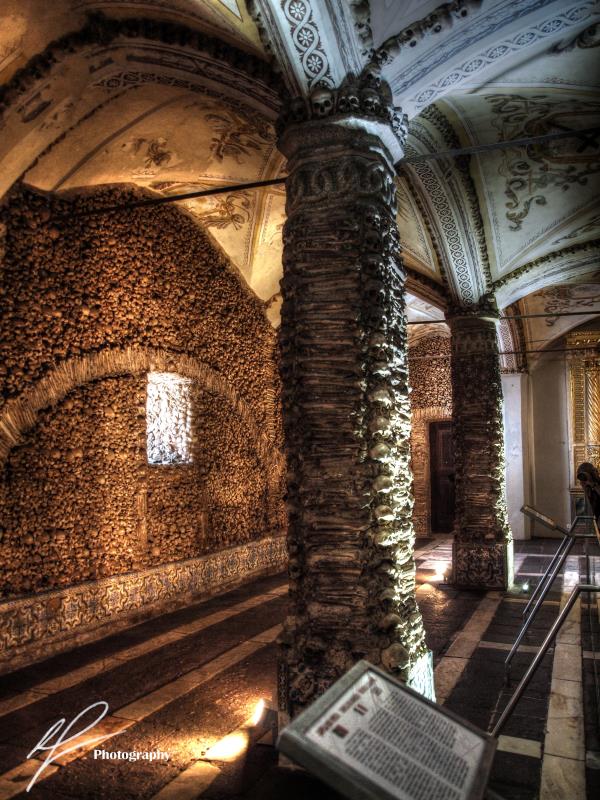 A look inside the Capela dos Ossos, or Chapel of Bones, located in the Portuguese city of Evora.  Features a warning at the entrance: “We, the bones that are here, await yours."