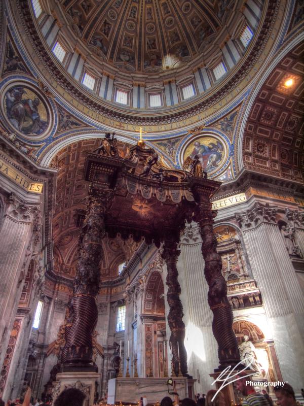 This is a photo underneath the massive dome of St Peter's Basilica in the Vatican City.  The pavilion-like structure in the centre stands 30 metres tall!