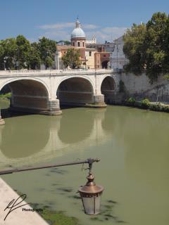 This is a nice photo of the Tiber river which slowly runs through the centre of the 'Eternal City' - Rome, Italy.