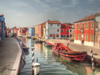 The pastel colours of the low rise buildings decorating the canals of Burano make for a beautiful backdrop.