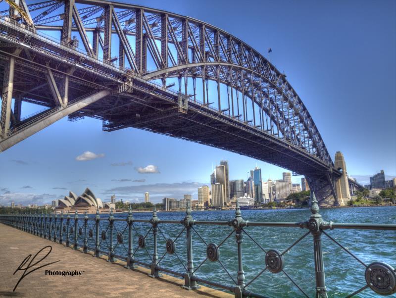 From near Luna Park in North Sydney, you are offered a great view of both the Opera House in the distance and the Harbour Bridge looming above.