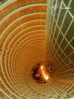 The amazing view inside the famous Jin Mao tower in the Pudong district in Shaghai, China.  The view encompasses a view of a drop of about 30 stories.